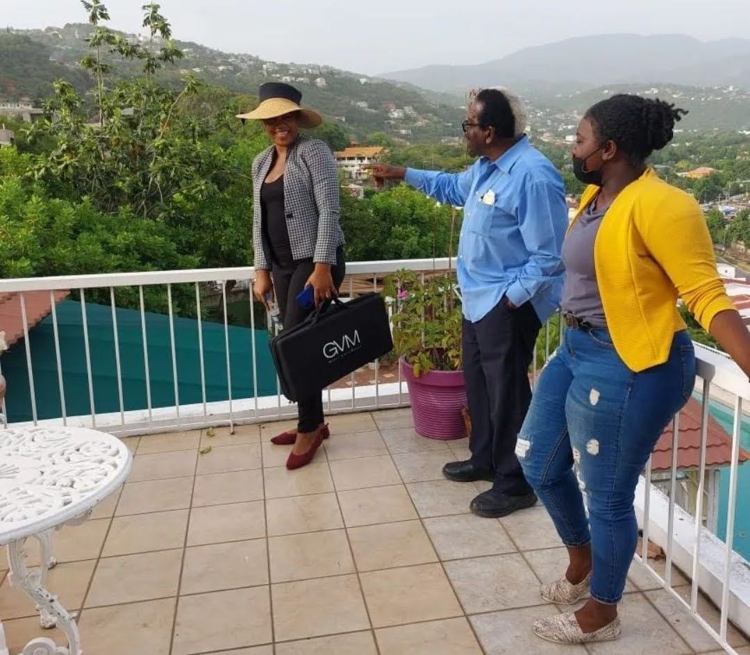 Kadine Reynolds with Pearnel Charles Sr on a rooftop terrace