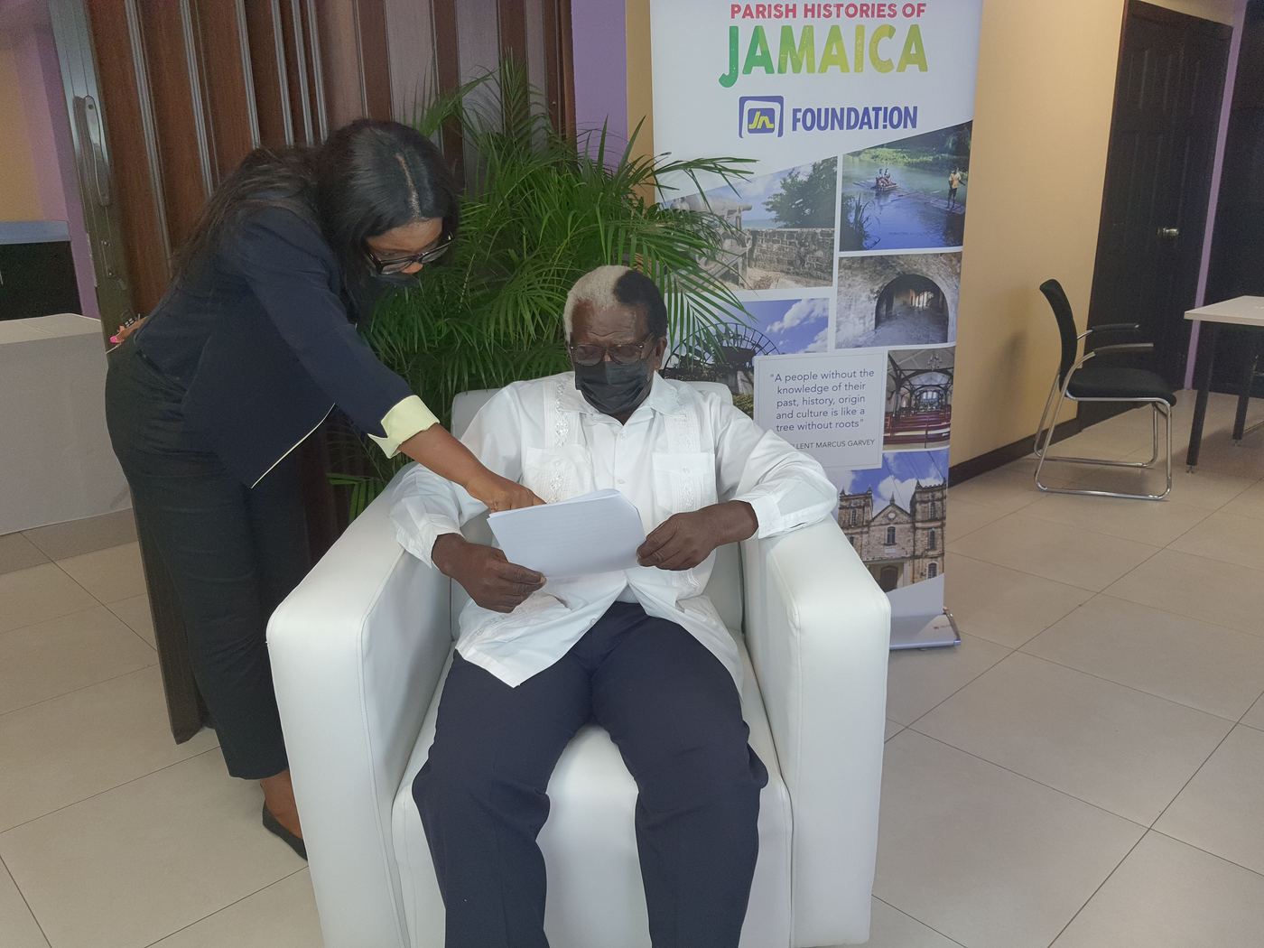 Kadine Reynolds guiding Pearnel Charles Sr through his notes before a live taping